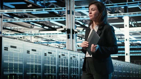 Data center system administrator looks at virtual graphics to optimize servers Stock Footage 329328716