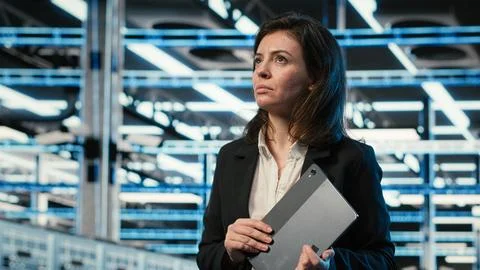 Data center system administrator looks at virtual graphics to optimize servers Stock Photos
