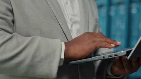 Data center system administrator reviewing code for automation scripts Stock Footage 311831682