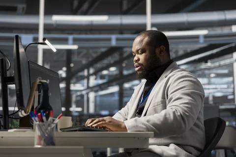 Data center system administrator running diagnostic scripts Stock Photos