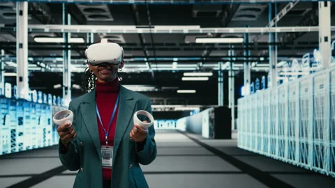Data center system administrator uses VR headset gear and AR simulation Stock Footage 329532133