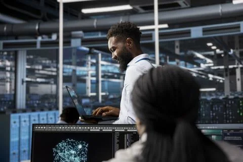 Data center system administrator uses AI visualization tech to oversee tasks Stock Photos