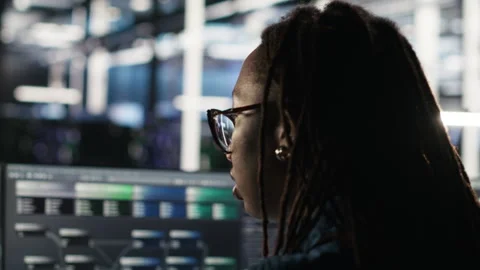 Data center system administrator using algorithms to analyze large datasets Stock-Footage 307019106