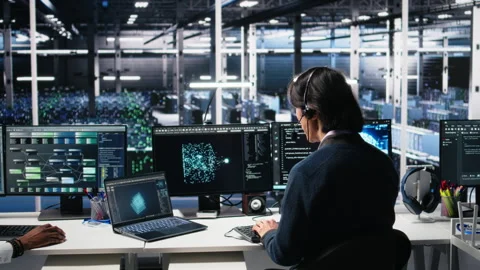 Data center system administrator using AI assistant to provide technical support Stock Footage 313569575