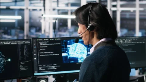 Data center system administrator using AI assistant to provide technical support Stock Footage 313636512
