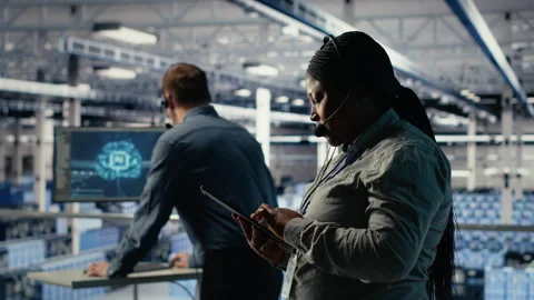 Data center system administrator using AI on tablet to help customers Stock Footage 314805345