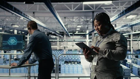Data center system administrator using AI on tablet to help customers Stock Footage 314805879
