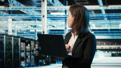 Data center system administrator using AR tech to conduct security audit Stock Footage 329328870