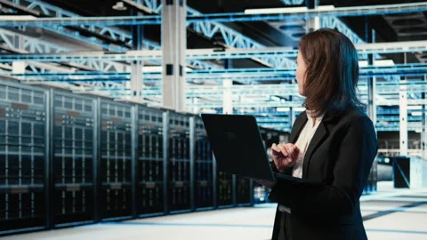 Data center system administrator using AR tech to conduct security audit Stock Footage 330099570