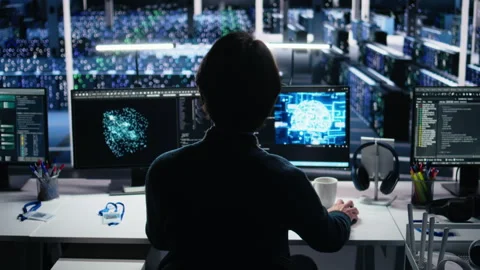 Data center system administrator working on artificial intelligence neural Stock Footage 313568583