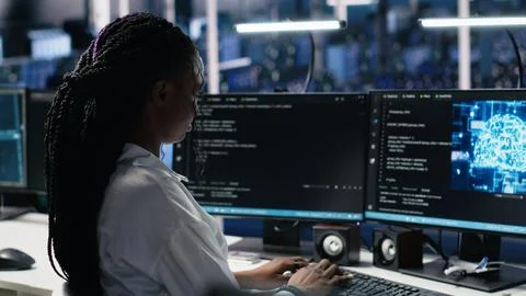 Data center system administrator working on neural network tech 写真素材