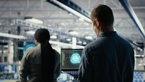 Data center system administrators investigate neural networks configuration Stock Footage 314685401