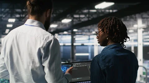 Data center system administrators performing maintenance on AI supercomputers Stock Footage 310278334