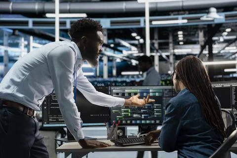 Data center system administrators setting up machine learning systems Stock Photos