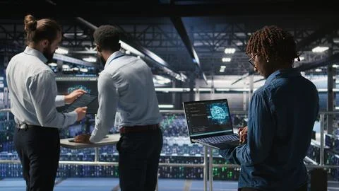Data center system administrators using artificial intelligence Stock Photos