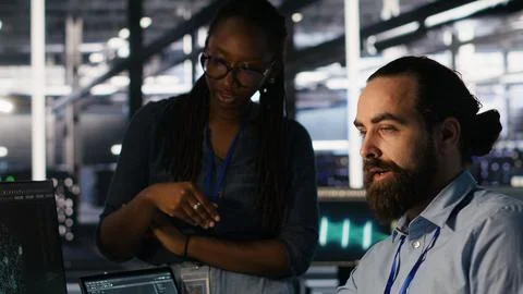 Data center system administrators working together 스톡 사진