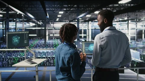 Data center team on industrial platform using artificial intelligence Stock Footage 310789186
