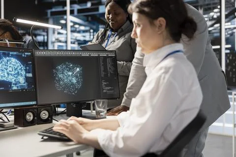 Data center team of programmers using artificial intelligence Foto stock