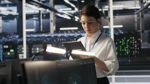Data center team of technicians working on neural network software development Stock Footage 309623018