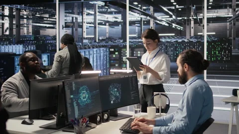 Data center team of technicians working on neural network software development Stock Footage 309644375