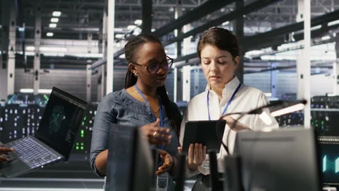 Data center teamworking colleagues performing maintenance on server racks 스톡 동영상 309631446