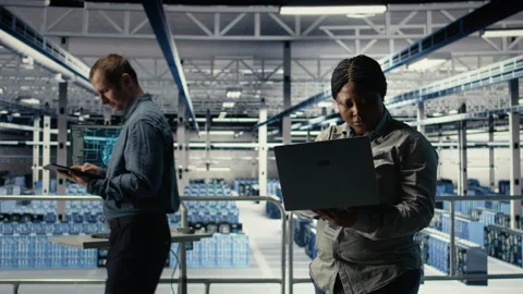 Data center technician deploys machine learning software on infrastructure Stock Footage 314684626