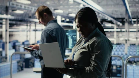 Data center technician deploys machine learning software on infrastructure Stock Footage 314685591