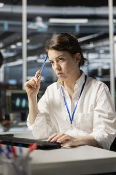 Data center technician doing brainstorming on how to fix gear Stock Photos