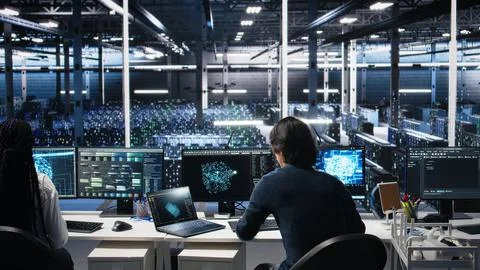 Data center technician entering office, managing AI systems Stock Photos
