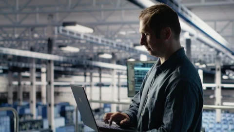 Data center technician monitors deep learning process with laptop Stock Footage 314685559