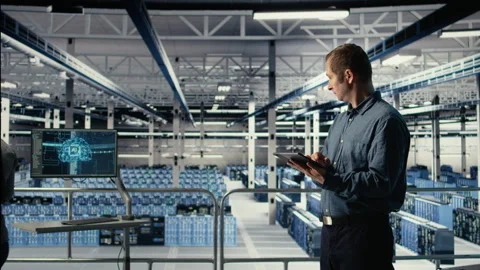 Data center technician monitors machine learning process with tablet Stock Footage 314683252