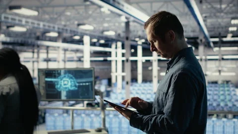 Data center technician monitors machine learning process with tablet Stock Footage 314803782