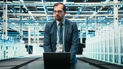 Data center technician uses laptop and augmented reality to upgrade server racks Stock Footage 329714917