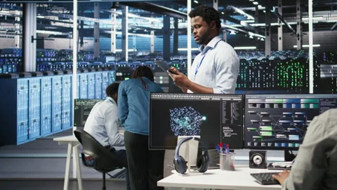 Data center technician using tablet to do node tree programming Stock Footage 307016373