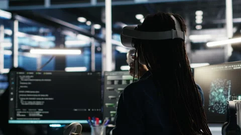 Data center technician using virtual reality tech and node tree software Stock Footage 307037989