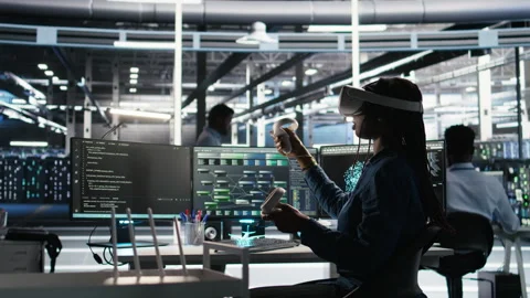 Data center technician using virtual reality tech and node tree software Stock Footage 307043692