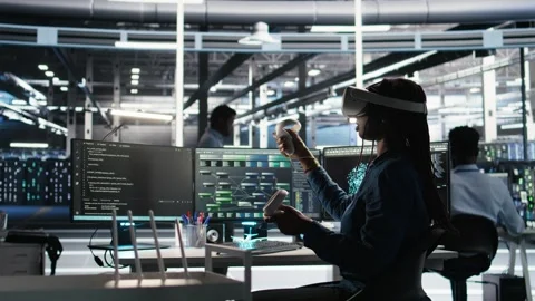 Data center technician using virtual reality tech and node tree software Stock Footage 309511390