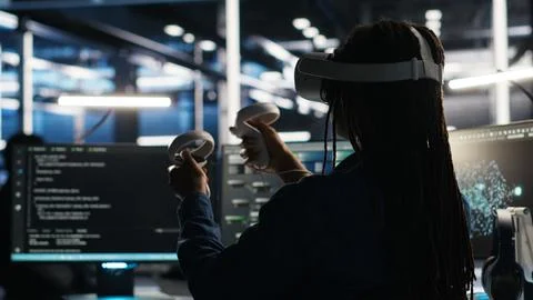 Data center technician using virtual reality tech and node tree software 写真素材