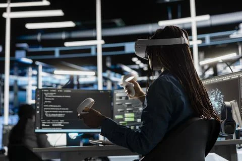 Data center technician using VR headset to visualize AI neural networks Stock Photos