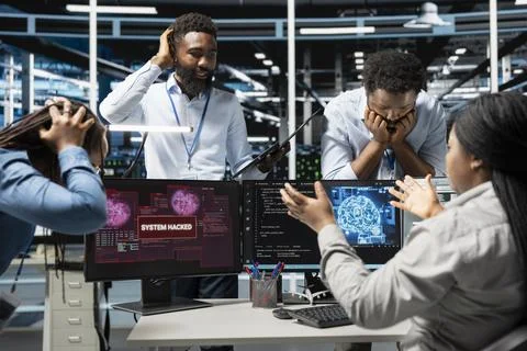 Data center technicians using AI panicking after virus attack warning 库存照片