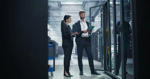 Data Center Two Specialists at Work Stock Footage 320866369