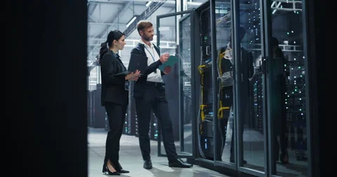 Data Center Two Specialists at Work Stock Footage 320866396