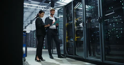 Data Center Two Specialists at Work Stock Footage 320866444