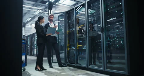 Data Center Two Specialists at Work Stock Footage 320866583