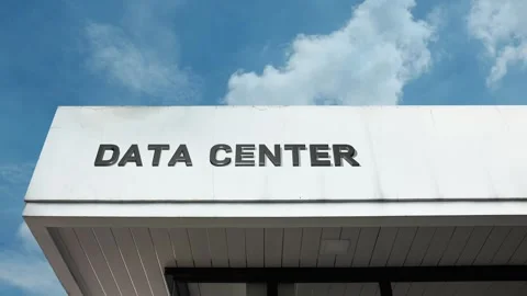 Data center word sign displayed on building with blue sky background Stock Footage 318607414