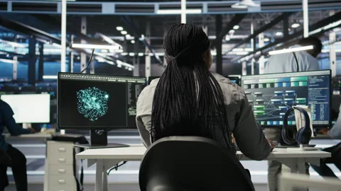 Data center worker analyzes datasets using deep learning node tree programming Stock Footage 307039083