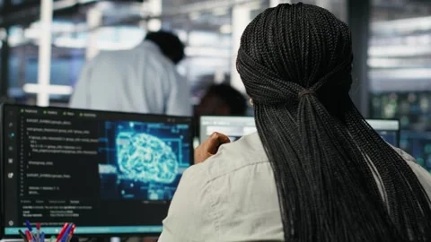 Data center worker analyzes datasets using deep learning node tree programming Stock Footage 309118048