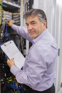 Data center worker checking the servers Stock Photos