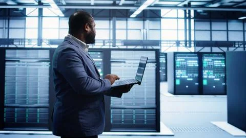 Data center worker fixing errors affecting supercomputers Stock Photos