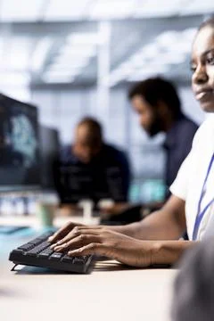 Data center worker implementing AI driven predictive analytics solutions Stock Photos